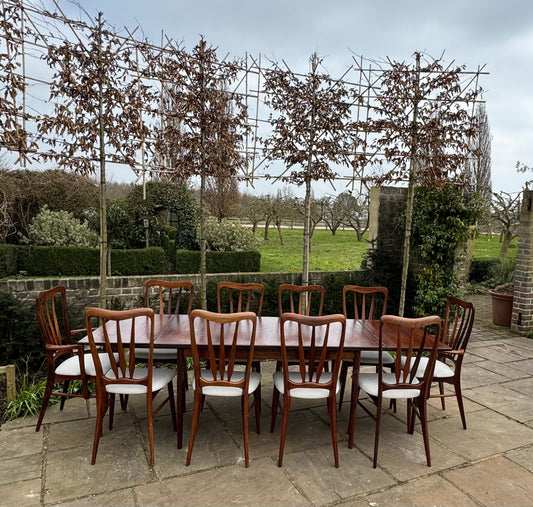 For Regina ***Price includes delivery ***Mid Century Modern Danish Rosewood Large Dining Table and 10 Rosewood Dining chairs by Niels Keofoed - 1960