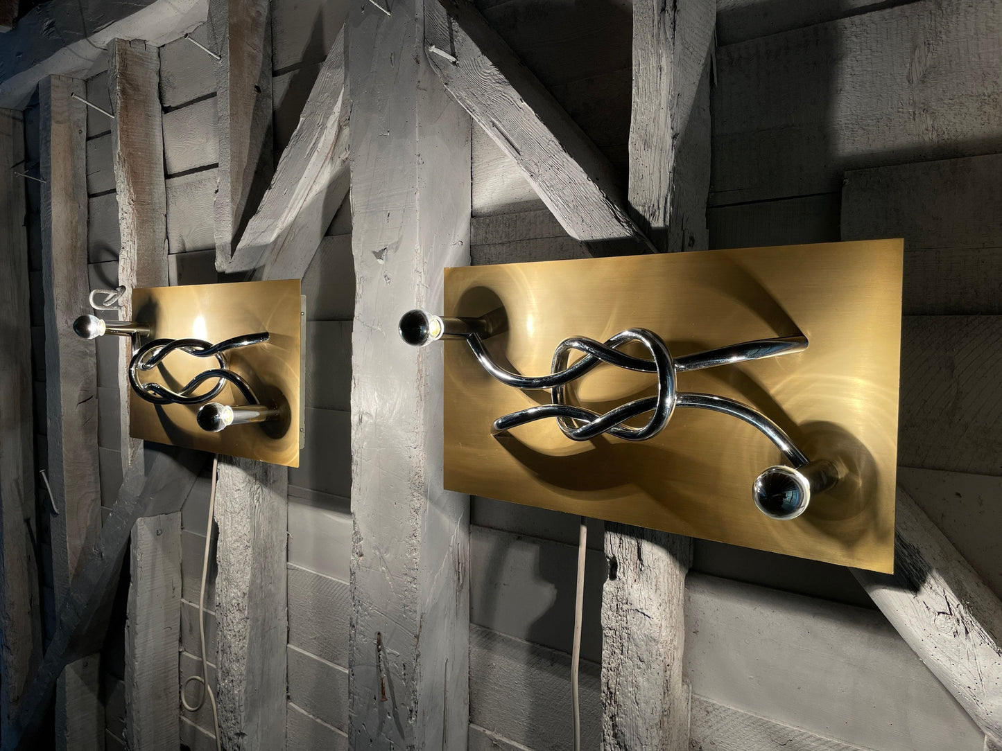 A Pair of 1970s Mid Century Modern Italian 'Reef Knot' Wall Light Panels / Sconces designed by Giacomo Benevelli for Missaglia