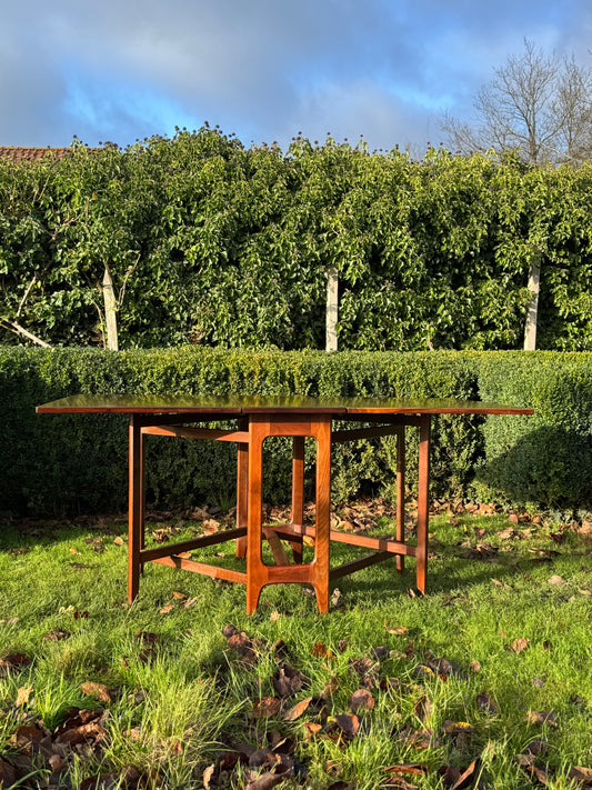 For Lacey **Price includes shipping, crate, CITES and tariffs ** Fifty per cent deposit ***for Mid Century Rosewood drop leaf dining table by Bendt Winge for Kleppes Moblefabrick, Norway 1960.