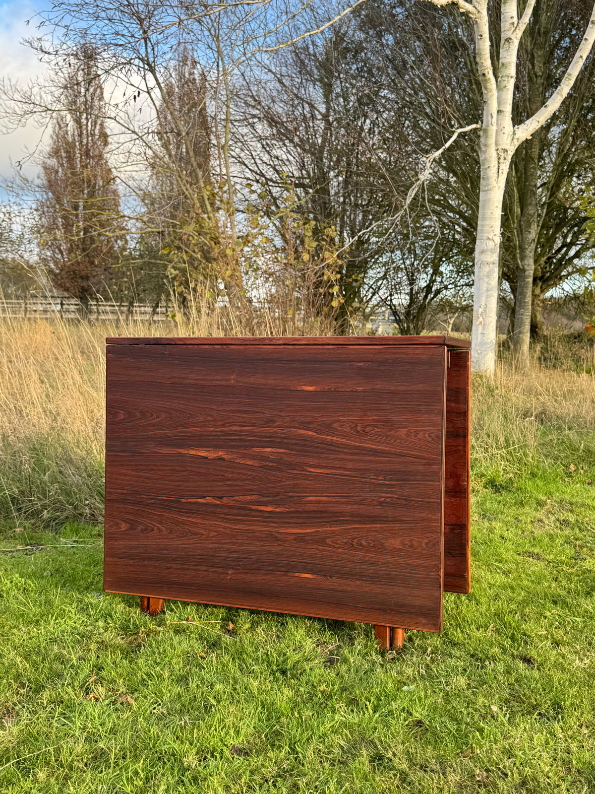 For Lacey **Price includes shipping, crate, CITES and tariffs ** Fifty per cent deposit ***for Mid Century Rosewood drop leaf dining table by Bendt Winge for Kleppes Moblefabrick, Norway 1960.