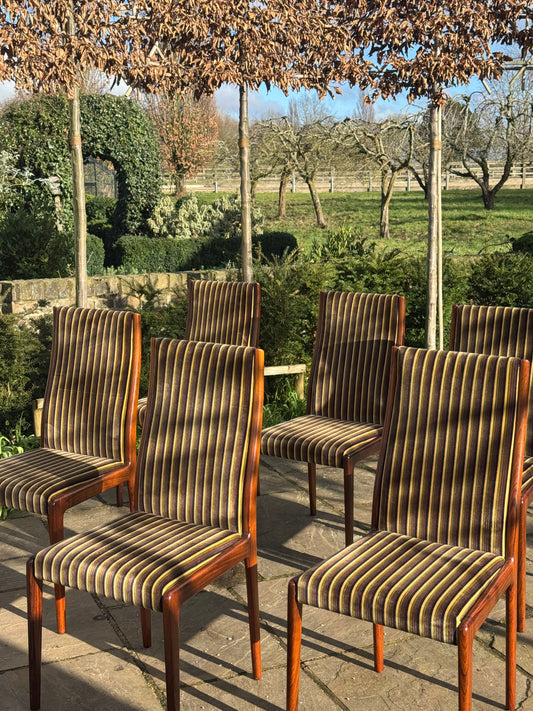For Kyle**price includes shipping,crate,CITES and tariffs **Set of eight Rosewood dining chairs by Robert Heritage for Archie Shine 1970.