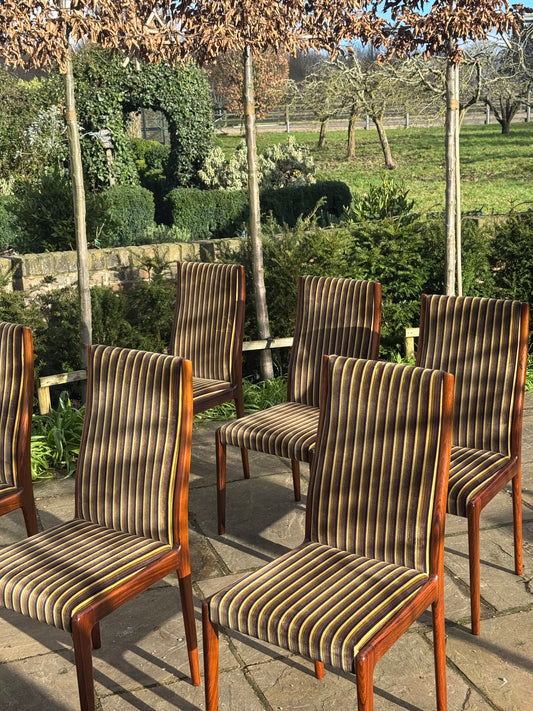 For Kyle**price includes shipping,crate,CITES and tariffs **Set of eight Rosewood dining chairs by Robert Heritage for Archie Shine 1970.